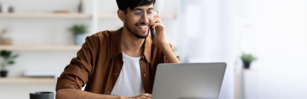 Young businessman on laptop in home office