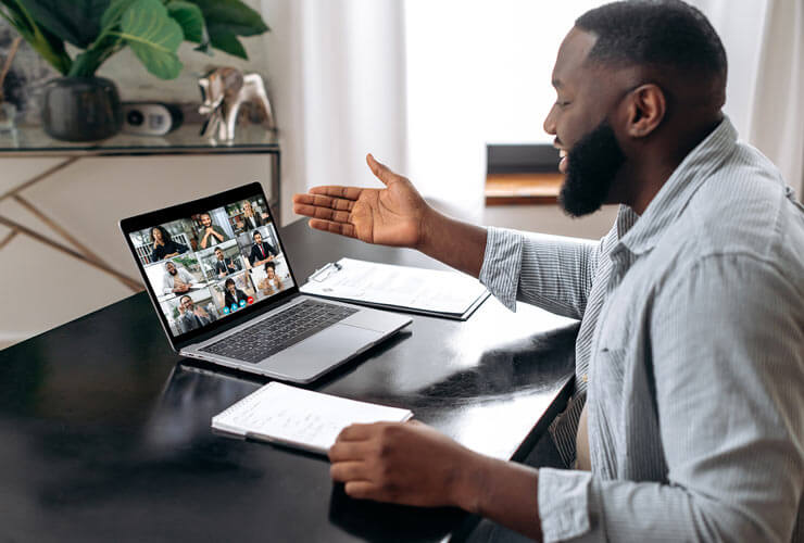 Man works from home on a teleconference call